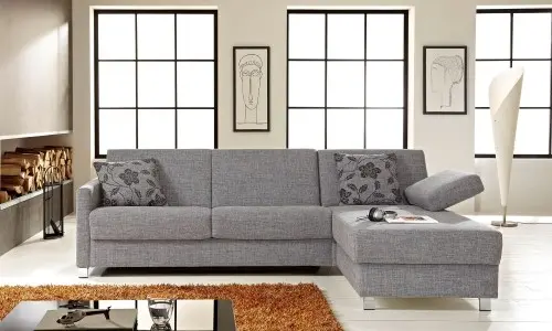 Schlafsofa mit Récamiere, Stauraum sowie Matratze und Rost