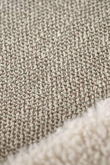 Hellgrüner Stoff eines Sofas.