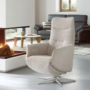 Hellgrauer Designer Relaxsessel mit silbernem Sternfuß.