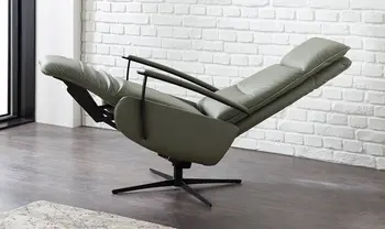 Olivgrüner Relaxsessel aus Leder in Herz-Waage-Position.