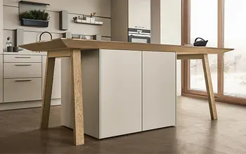 Der Kochtisch von next125. Ein Esstisch mit integrierten Küchenschubladen und Kochfeld.&nbsp;