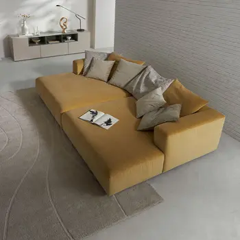 Gelbes Design Daybed mit vielen Dekokissen von oben. 