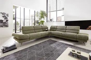 Großes grünes Ecksofa mit hohen Rückenlehnen.