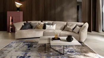 Beiges Design Sofa in Trapezform.