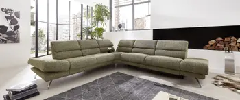 Großes grünes Ecksofa mit hohen Rückenlehnen.