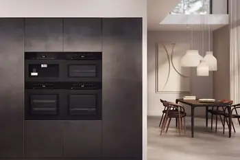 Miele Ofen und Einbaukaffemaschine in dunkler Küchenzeile