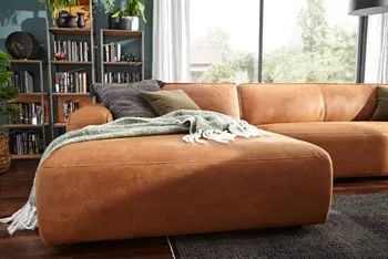 Ecksofa in Leder mit cognacfarbenem Stoff mit großem Longchair.