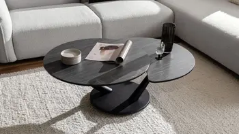 Runder Design Couchtisch mit ausgezogener Verlängerung.