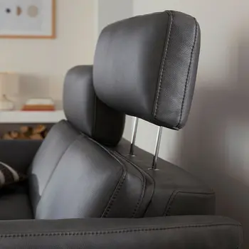 Graue Design Leder Garnitur mit verstellbaren Kopfstützen.